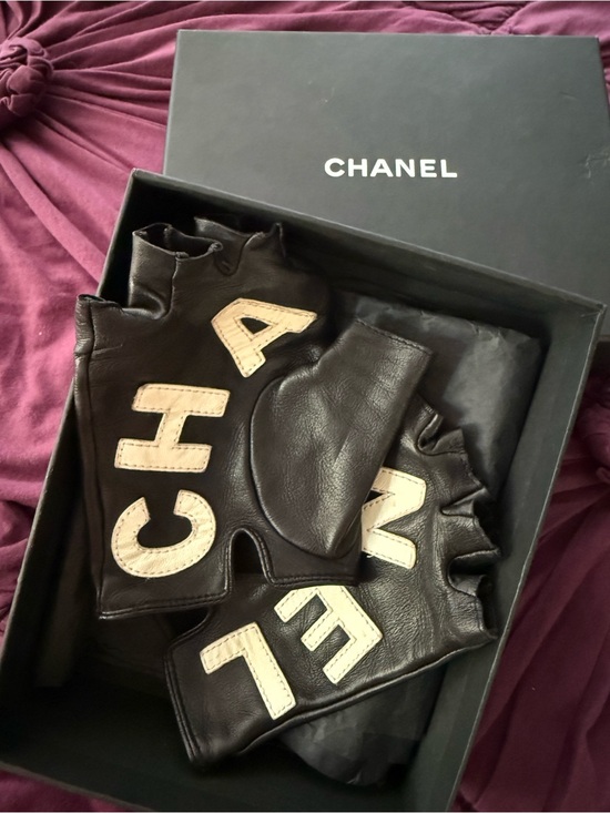 CHANEL Accessories - CHANEL Black Fingerless Leather Gloves with Cream Logo Letters